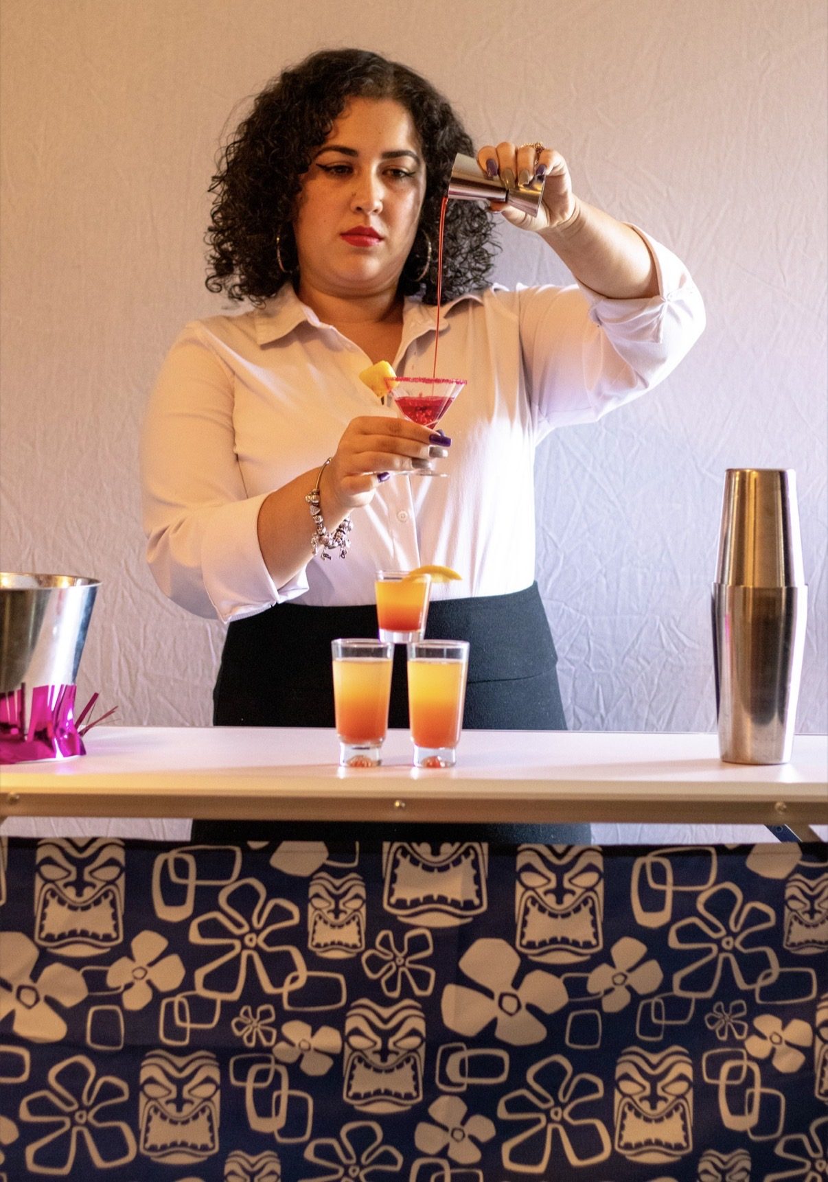 Bartender pouring a cocktail